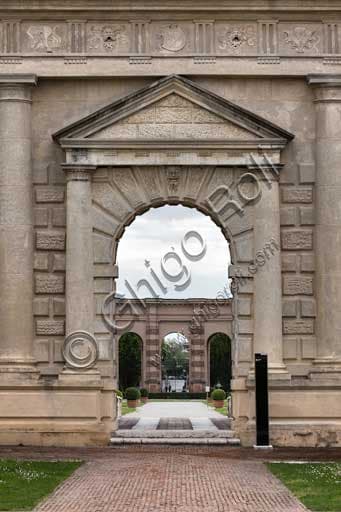 Mannerist architectural portal in the Honour Courtyard of Palazzo Te in Mantua leading into the historic garden