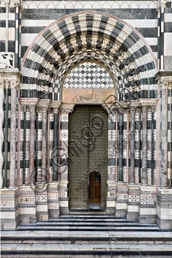 Right doorway, west façade of St. Lawrence Cathedral in Genoa, Italy