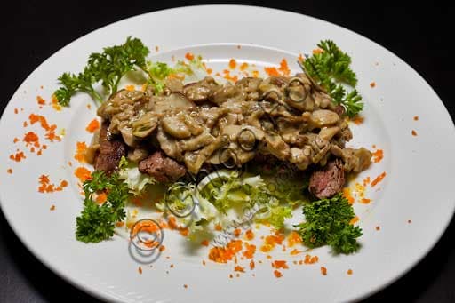 Sliced steak served with sauteed porcino mushrooms, a savory mushroom steak dish