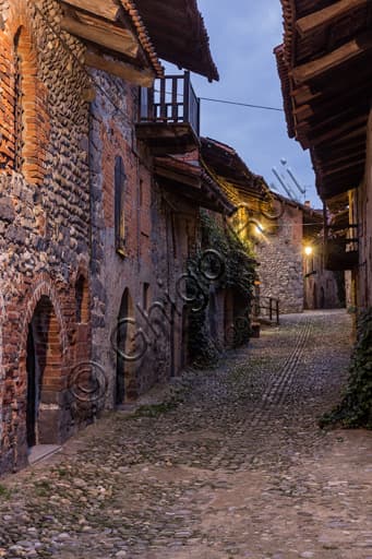Night time evening view of a medieval rua street inside the Ricetto di Candelo, Biella, Piedmont Italy