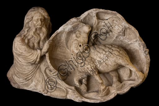 Marble sculpture relief of Saint John the Evangelist holding the Agnus Dei, detail from the Treasure Museum of St. Lawrence Cathedral in Genoa