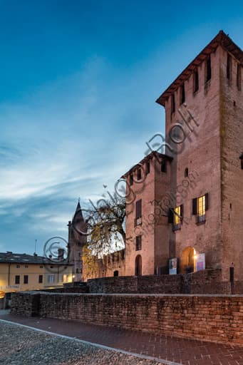 Illuminated night view of the Rocca Sanvitale, Fontanellato castle, reflected in the surrounding moat