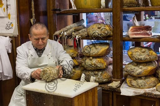 Selection of Parmigiano Reggiano DOP and Parma Ham at Salumeria Pancaldi in Reggio Emilia, Italy