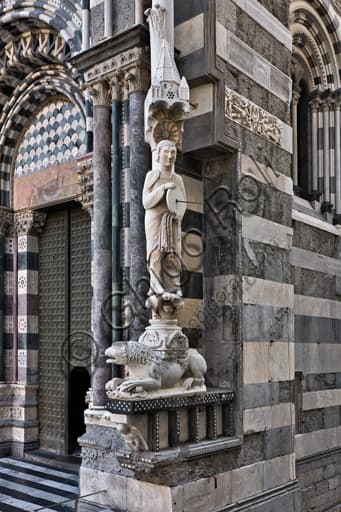 Medieval Knife Grinder sculpture with sundial, Genoa Cathedral, south-west façade