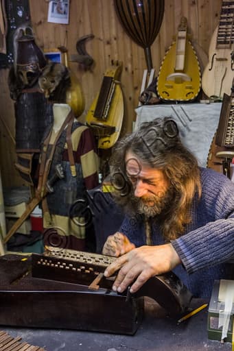 Sergio Verna at work in his lutherie workshop in the Ricetto of Candelo, specializing in girondas