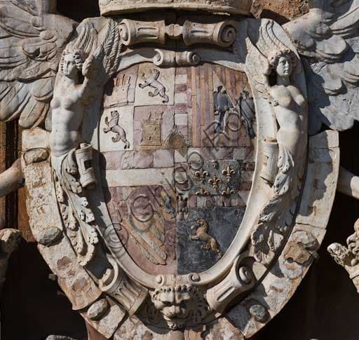Close-up detail of the carved heraldic coat of arms featuring the Aragon eagle on the main portal of the Renaissance wing, Palazzo dei Normanni, Palermo.