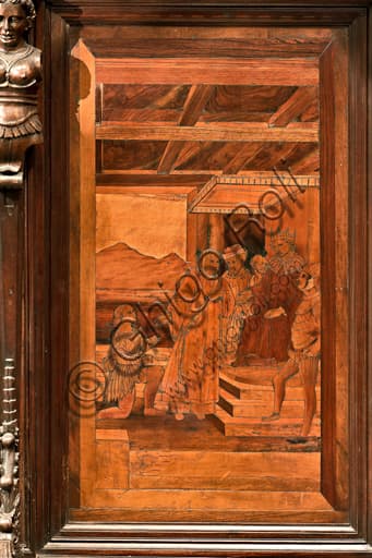 Wood intarsia depicting St. Lawrence before Decius, north choir stall, Genoa Cathedral