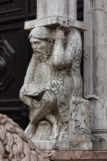 Sculptural detail of the telamon supporting the Romanesque prothyrum on the façade of the Cathedral of St. George in Ferrara