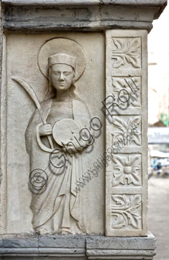 Detail sculpture pilgrim with palm and wheel, Antonio Grimaldi tomb, St. Lawrence Cathedral, Genoa, Italy