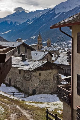 Partial view of Bormio featuring the Church of S. Ignazio with the Italian Alps in the background