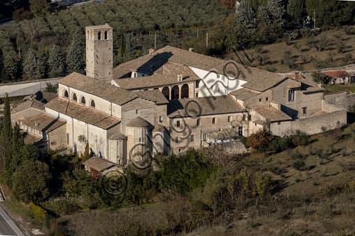 Panoramic view of the Monastery of St. Ponziano complex in Spoleto, Italy, featuring historic architecture and a bell tower.