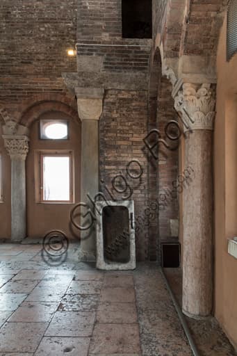 View of the corner between the west and south walls in the Torresani Hall of Modena's Ghirlandina Tower with works by the Campionese Masters