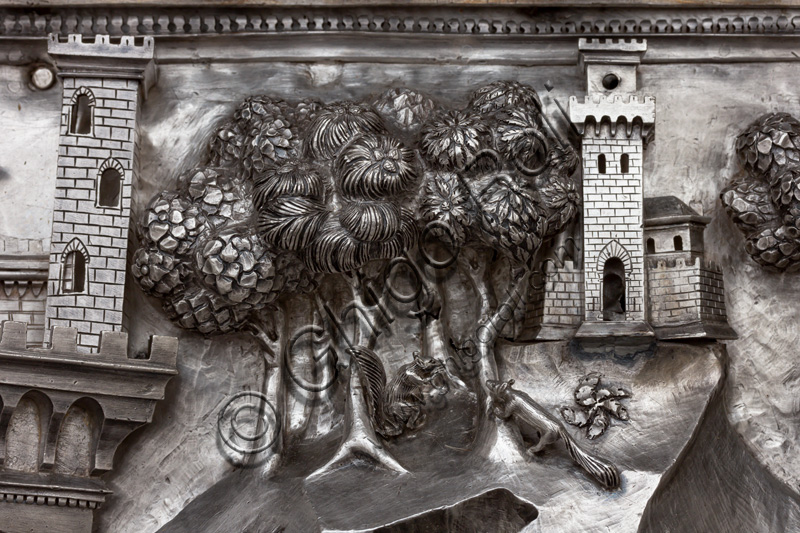 “Infant St. John sets out towards the desert”, by fourteenth-century Florentine goldsmiths.Tile of “The Silver Altar of St. John's Treasure” (1367 - 1483), Museum of the Opera del Duomo (Museum of Florence Cathedral of Santa Maria del Fiore), Florence.Detail representing a town and some trees.