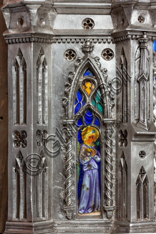 Florence, Museum of the Opera del Duomo (Museum of Florence Cathedral of Santa Maria del Fiore): “the silver altar of St. John's Treasure” (1367 - 1483), by florentine masters.Front of the dossal:  upper detail of an angel in coloured enamels within an ogival window.