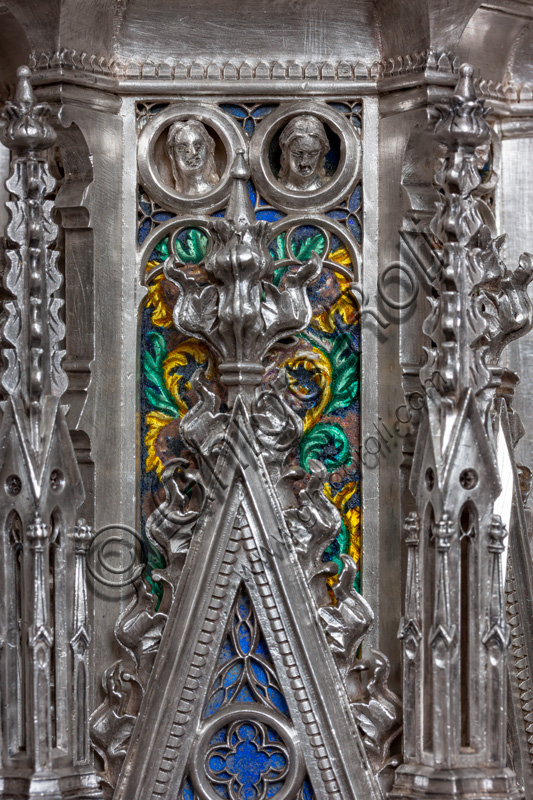 Florence, Museum of the Opera del Duomo (Museum of Florence Cathedral of Santa Maria del Fiore): “the silver altar of St. John's Treasure” (1367 - 1483), by florentine masters.Fourth pillar: detail with enamels and female heads within clypei.