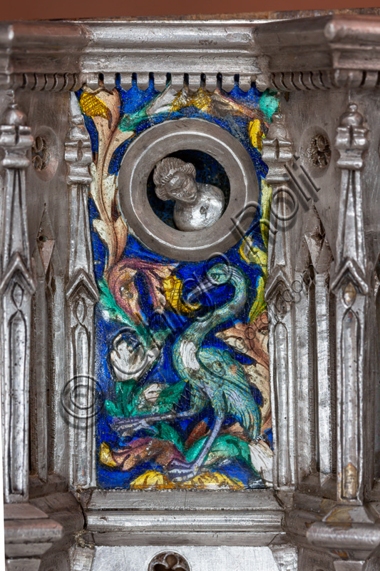 Florence, Museum of the Opera del Duomo (Museum of Florence Cathedral of Santa Maria del Fiore): “the silver altar of St. John's Treasure” (1367 - 1483), by florentine masters.Front of the dossal: detail with a bird (a stork?), enamel floral motifs and head within clypeus.