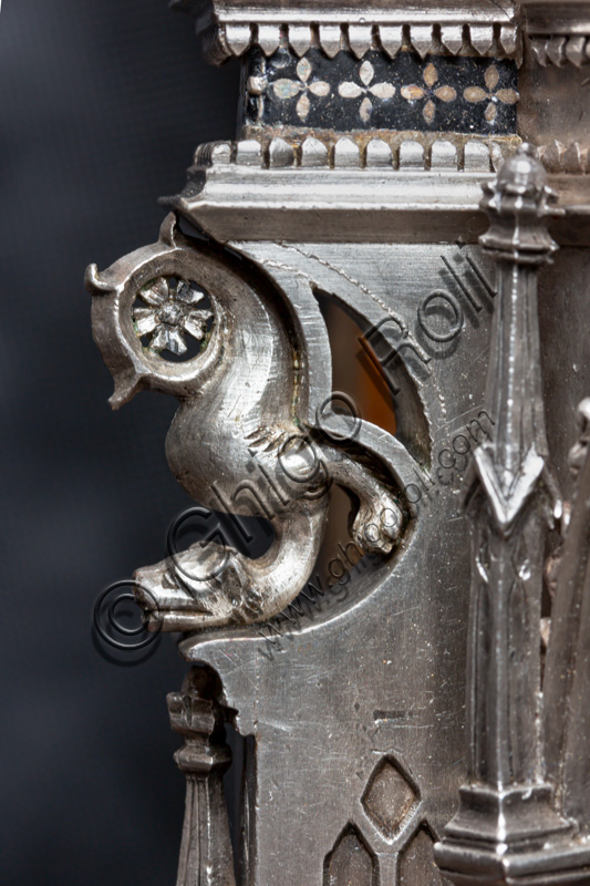 Florence, Museum of the Opera del Duomo (Museum of Florence Cathedral of Santa Maria del Fiore): “the silver altar of St. John's Treasure” (1367 - 1483), by florentine masters.Upper detail of the corner pillar between the front of the dossal and the left side, with a “figure of a fantastic animal” (gothic type of gargoyle).