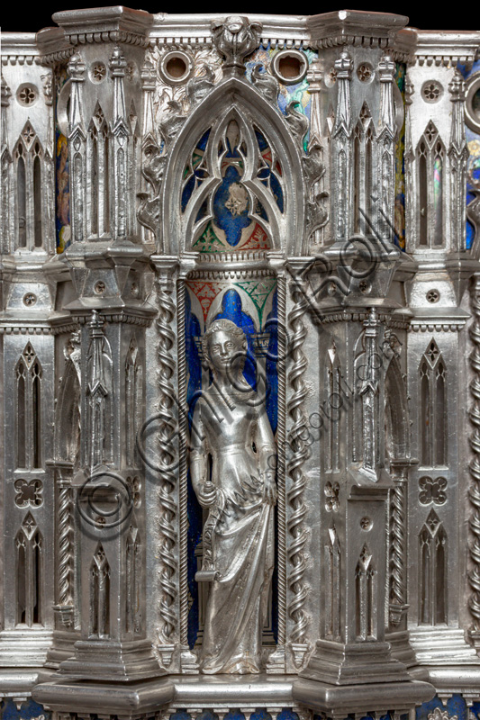 Florence, Museum of the Opera del Duomo (Museum of Florence Cathedral of Santa Maria del Fiore): “the silver altar of St. John's Treasure” (1367 - 1483), by florentine masters.Front of the dossal: upper detail of the fifth pillar with a statuette of a saint holding a parchment, within a niche.