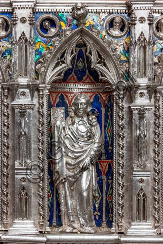 Florence, Museum of the Opera del Duomo (Museum of Florence Cathedral of Santa Maria del Fiore): “the silver altar of St. John's Treasure” (1367 - 1483), by florentine masters.Front of the dossal, fourth top row: niche with a statue of a saint holding a book.