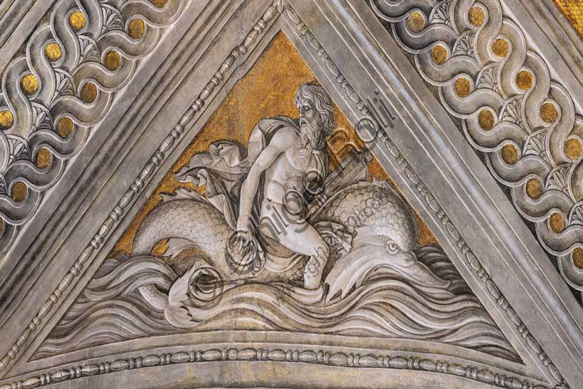 Ducal Palace: vault of the “Bridal Chamber or Camera Picta", which is a room located in the north-east tower of the Castle of San Giorgio in Mantua. It is famous for the cycle of frescoes that covers its walls, a masterpiece by Andrea Mantegna, created between 1465 and 1474.Detail of the vault: “Arion “saved by the dolphin”, a pendentive decorated with a fake bas-relief of mythological inspiration, which symbolically celebrates the intelligence of the marquis as a leader and statesman.