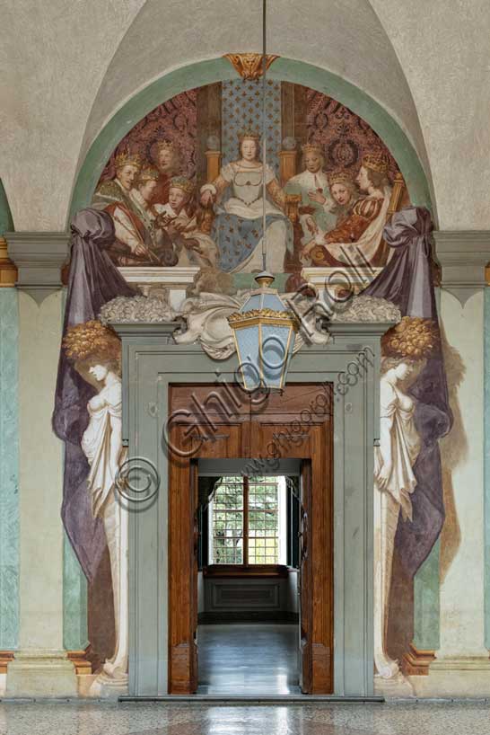 Medici Villa La Petraia, courtyard: “Catherine De’ Medici and her Children”, fresco from the cycle of the Fasti Medicei by Volterrano (Baldassarre Franceschini), 1636-1647.Catherine de' Medici, on a throne with the back draped with French lilies, is close to seven of her ten children (those who died at a very young age are missing): Francis II, Charles IX and Henry III, all kings of France, Francis Hercules , Duke of Alençon, and his daughters Elizabeth, Queen of Spain, Claudia, Duchess of Lorraine, and Margaret, wife of Henry of Navarre. The boys are arranged in a crown and each of them has the precise attributes of his royal or noble status (sceptres, crowns, jewels and cloaks).