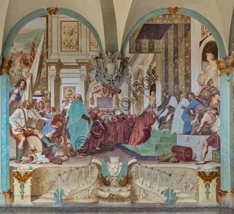 Villa medicea La Petraia, cortile:  “Cosimo I associa al governo il figlio Francesco”, affresco del ciclo dei Fasti Medicei del Volterrano (Baldassarre Franceschini), 1636-1647.Ambientata nel Salone dei Cinquecento in palazzo Vecchio, la scena mostra Cosimo I che protende a suo figlio Francesco in trono la nomina che lo associa al governo. Francesco riceve quindi l'omaggio dei senatori fiorentini, tra una variegata folla di astanti. Sulla parete si vedono la tartaruga del Festina lente, emblema di Cosimo e, anacronisticamente, il rinoceronte, che sarà l'emblema dell'altro figlio di Cosimo, Ferdinando I. Le statue della Pace e dell'Abbondanza, ai lati del trono, rappresentano un buon auspicio sul nuovo governo, vicino a funzionari di corte che versano sacchi di monete in un forziere. A sinistra si vede in primo piano un guerriero, seduto con espressione trasognata su un tamburo da guerra sfondato, perché non dovrà più suonare. 