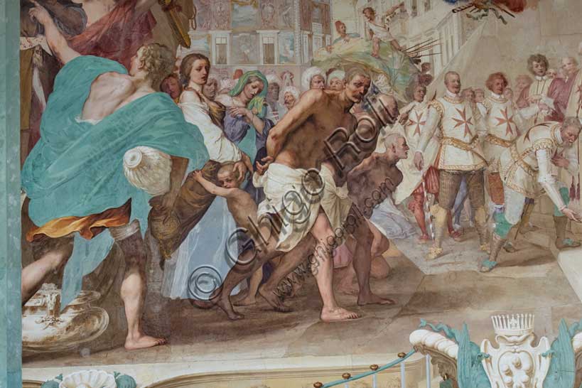 Medici Villa La Petraia, courtyard: “Cosimo II receives the winners of the Bona's feat”, fresco from the cycle of the Fasti Medicei by Volterrano (Baldassarre Franceschini), 1636-1647.Against the background of Piazza dei Cavalieri in Pisa, Cosimo II, still heir to the throne, receives in the churchyard of the church of Santo Stefano dei Cavalieri the Tuscan nobles engaged in a victorious expedition in the battle of Bona, in Algeria, fought between the Genoese and the Turks on 16 September 1608. Among those present are Silvio Piccolomini, Admiral Jacopo Inghirami, the Marquis Fabrizio di Colloredo and other knights, who climbed into the depths. In the foreground we see the prisoners, who are advanced in front of the spoils of war. The chained and bare-chested slaves have their counterpart in the clothed and turbaned prisoners near the prince.Detail.