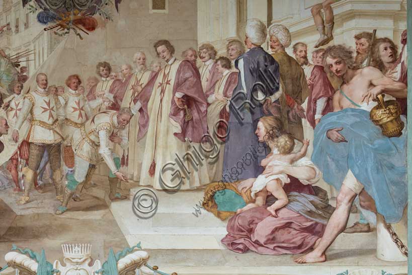 Medici Villa La Petraia, courtyard: “Cosimo II receives the winners of the Bona's feat”, fresco from the cycle of the Fasti Medicei by Volterrano (Baldassarre Franceschini), 1636-1647.Against the background of Piazza dei Cavalieri in Pisa, Cosimo II, still heir to the throne, receives in the churchyard of the church of Santo Stefano dei Cavalieri the Tuscan nobles engaged in a victorious expedition in the battle of Bona, in Algeria, fought between the Genoese and the Turks on 16 September 1608. Among those present are Silvio Piccolomini, Admiral Jacopo Inghirami, the Marquis Fabrizio di Colloredo and other knights, who climbed into the depths. In the foreground we see the prisoners, who are advanced in front of the spoils of war. The chained and bare-chested slaves have their counterpart in the clothed and turbaned prisoners near the prince.Detail.